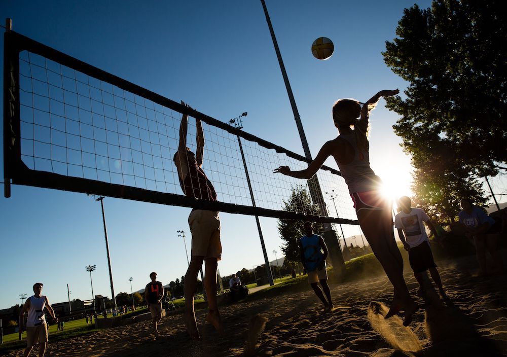 Participants play sand volleyball at the recs outdoor courts.